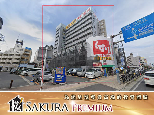 A 10 story residential building in front of Osaka Station with a 2800 square foot parking lot
